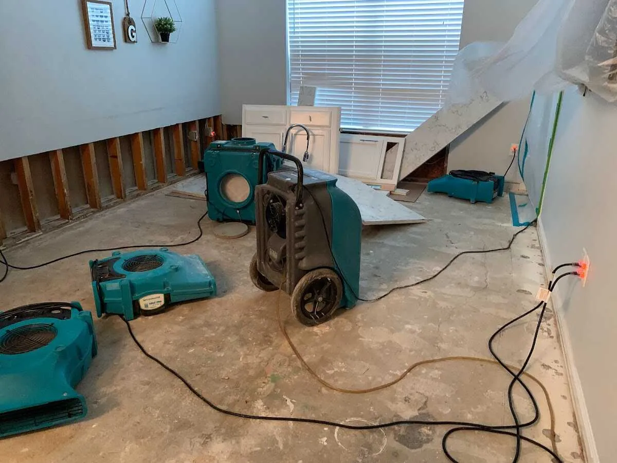 Dehumidifier in flood-cut room for Water Damage Restoration in Country Club Estates