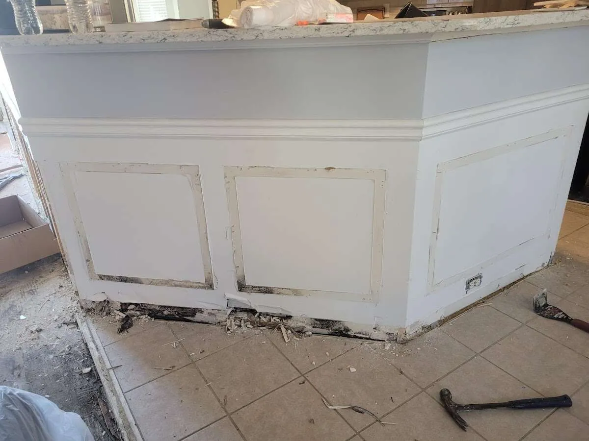 Water damage and mold on kitchen during Sewage Cleanup & Sanitation in Country Club Estates